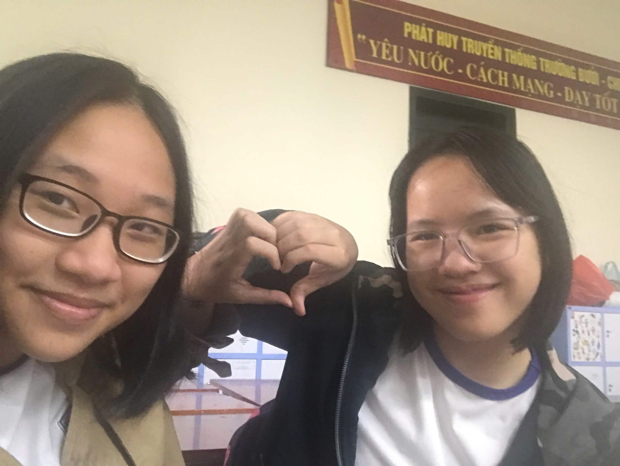 This is me and Mai Bùi during some recess, in a conversation that I can no longer remember. We just felt like taking a photo after Mai Bùi scrolled through her gallery—she said that photos are a part of a person. This photo is a part of me after she passed away